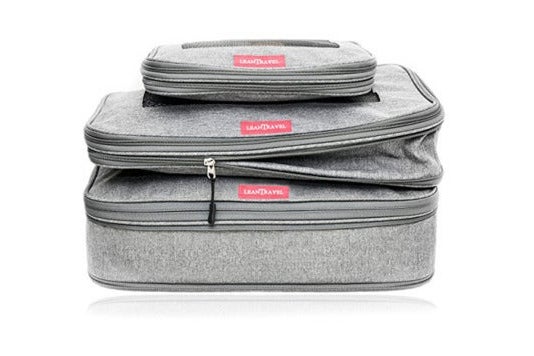 Three packing cubes, stacked.